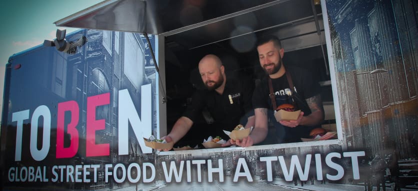 People serving food from food truck